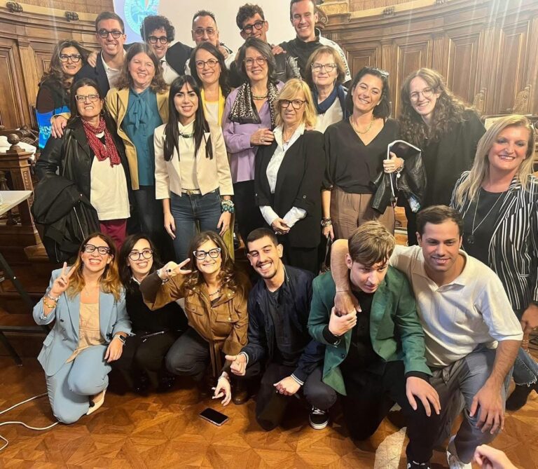 Dr Alice Montanaro in a group photo with 21 happy looking people who have helped her with her PhD research