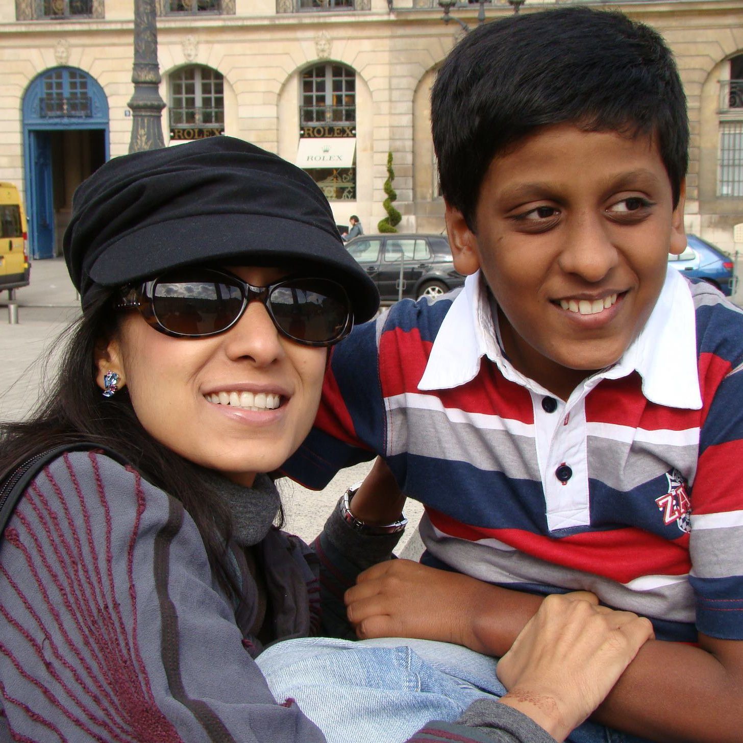 Shalini and her son smiling for the camera