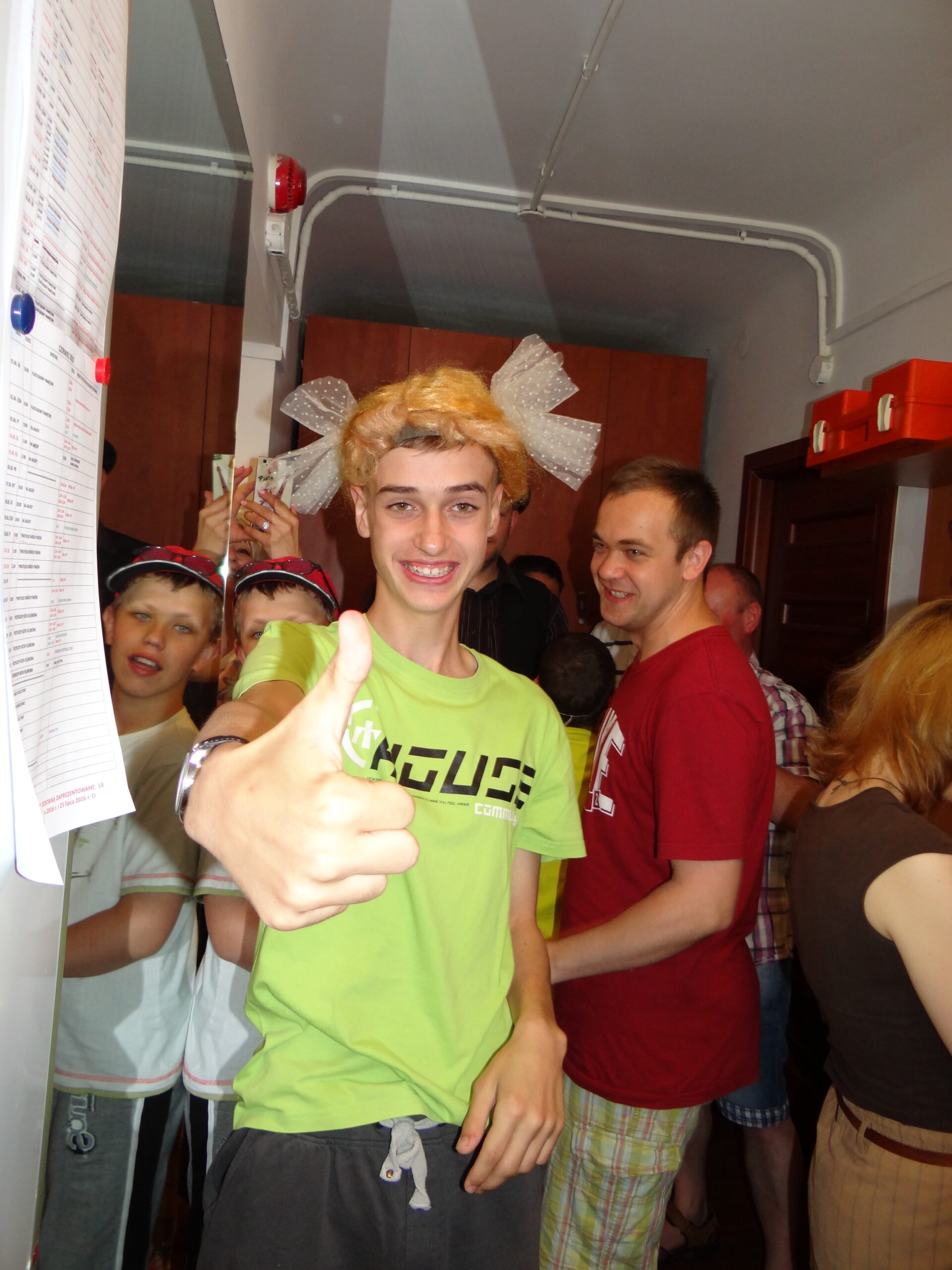 Boy with FXS shows a thumbs up